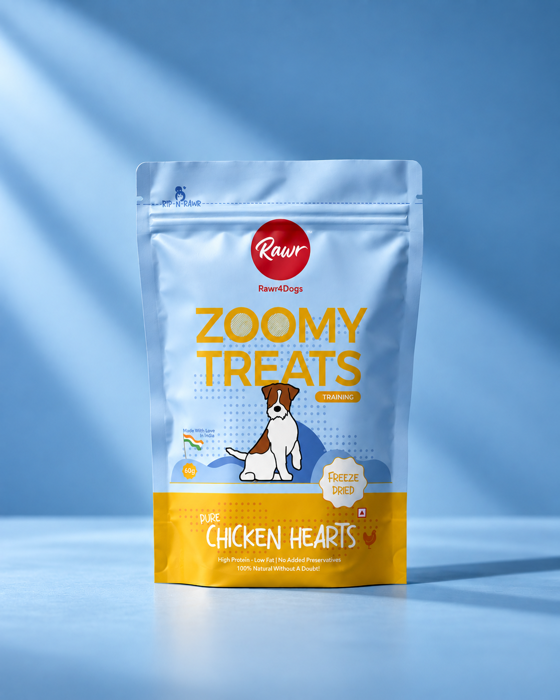 A stand-up pouch of Rawr RawDogs Zoomy Treats for dogs, featuring a light blue and yellow design with a cartoon dog illustration, set against a blue background with soft diagonal shadows.